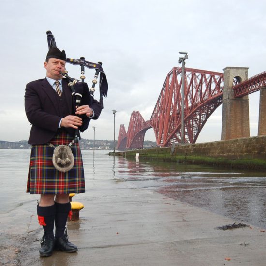 Wedding Piper Scotland at Firth of Forth with Forth Bridge and Forth Road Bridge and Queensferry Crossing in background