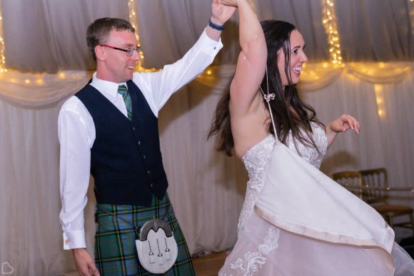 Bride and groom having fun during their first dance
