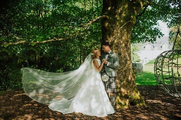 natalie-holt-central-scotland-wedding-photographer-supplier-venue-directory-bride-veil-outdoor-ceremony